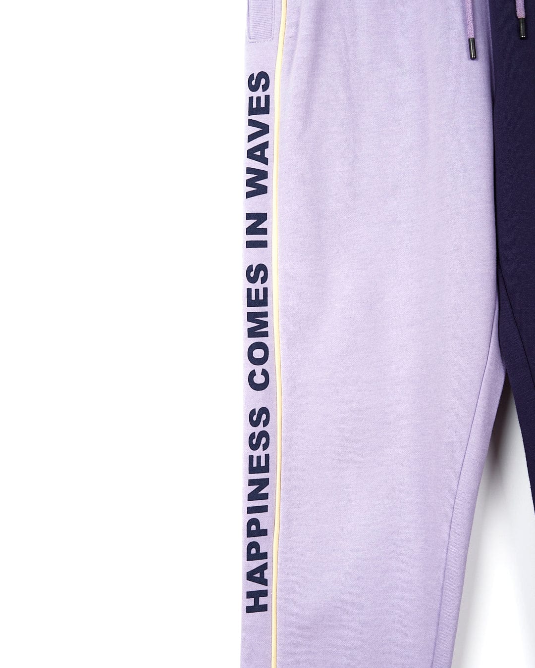A pair of Betty - Womens Jogger - Light Purple sweatpants from Saltrock with the words 'happiness waves' on them.