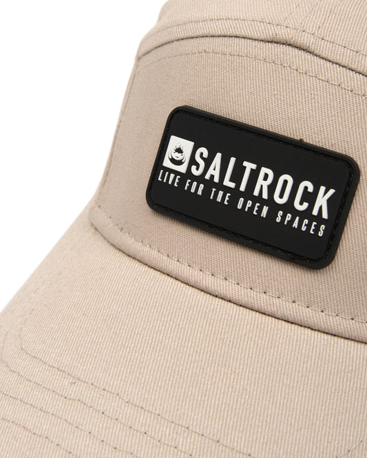 Beige Cotton hat featuring a black Saltrock logo patch, and an adjustable strap.