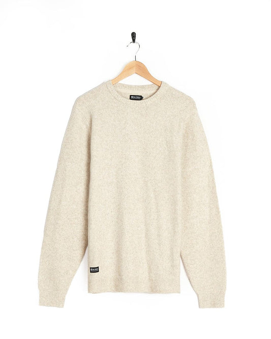 A Saltrock Bowen - Mens Knitted Crew Sweater - Cream hanging on a hanger.