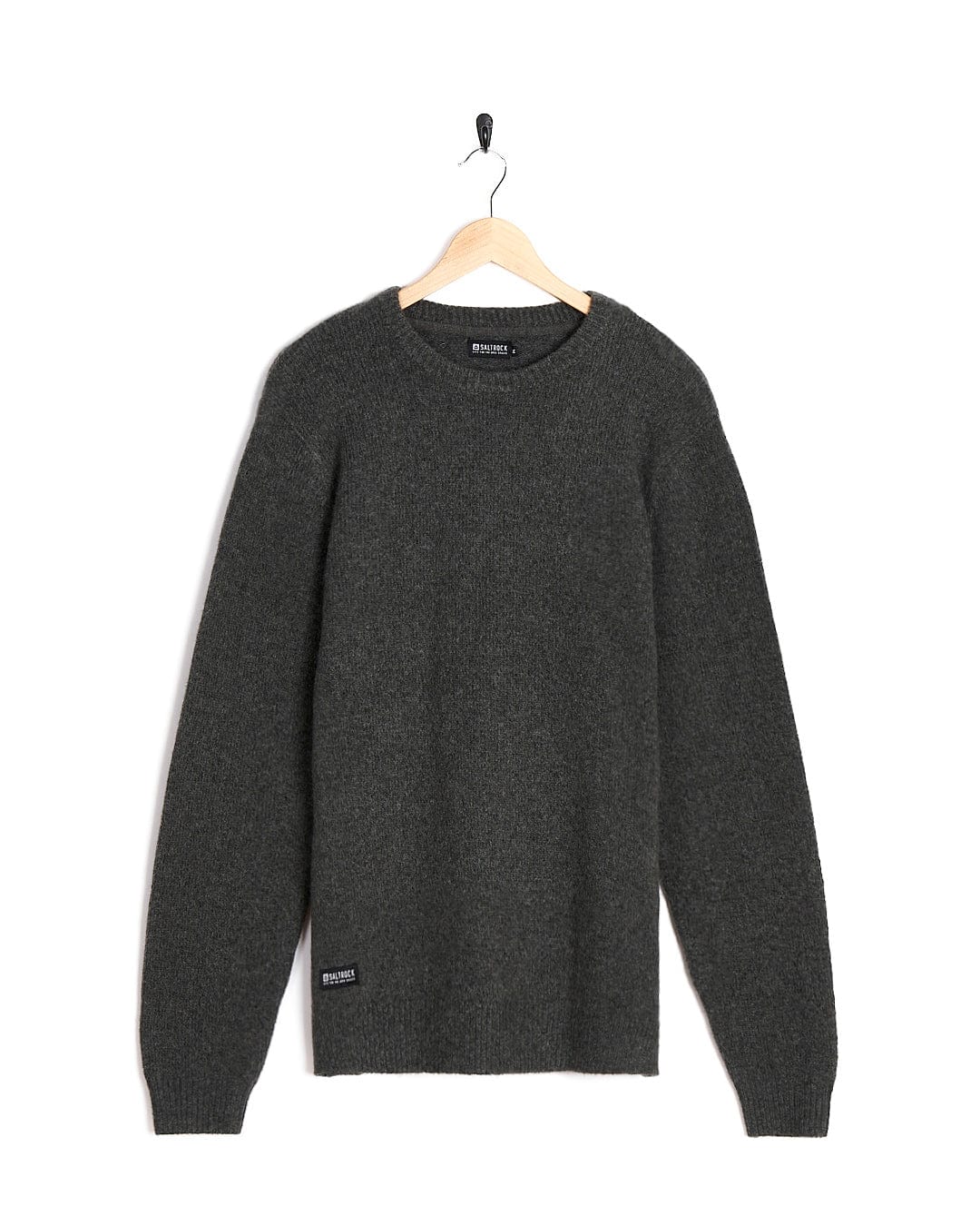 A Saltrock Bowen - Mens Knitted Crew - Dark Grey sweater hanging on a hanger.