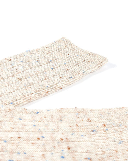 A pair of Saltrock Cabin - Socks - Cream with blue and white speckles.