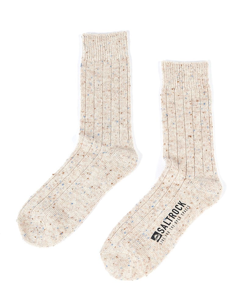 A pair of Cabin - Socks - Cream by Saltrock with a white logo on them.