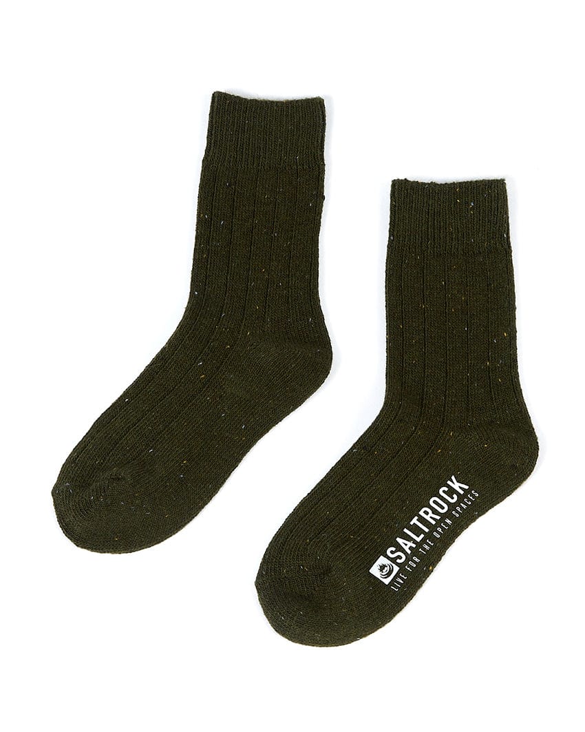 A pair of Cabin - Socks - Dark Green from Saltrock with a white logo on them.