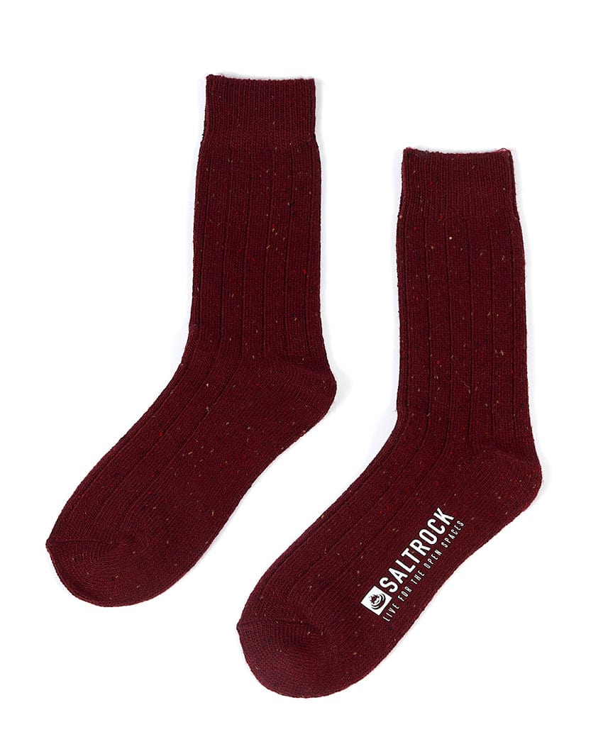A pair of Cabin socks in red with a Saltrock logo on them.