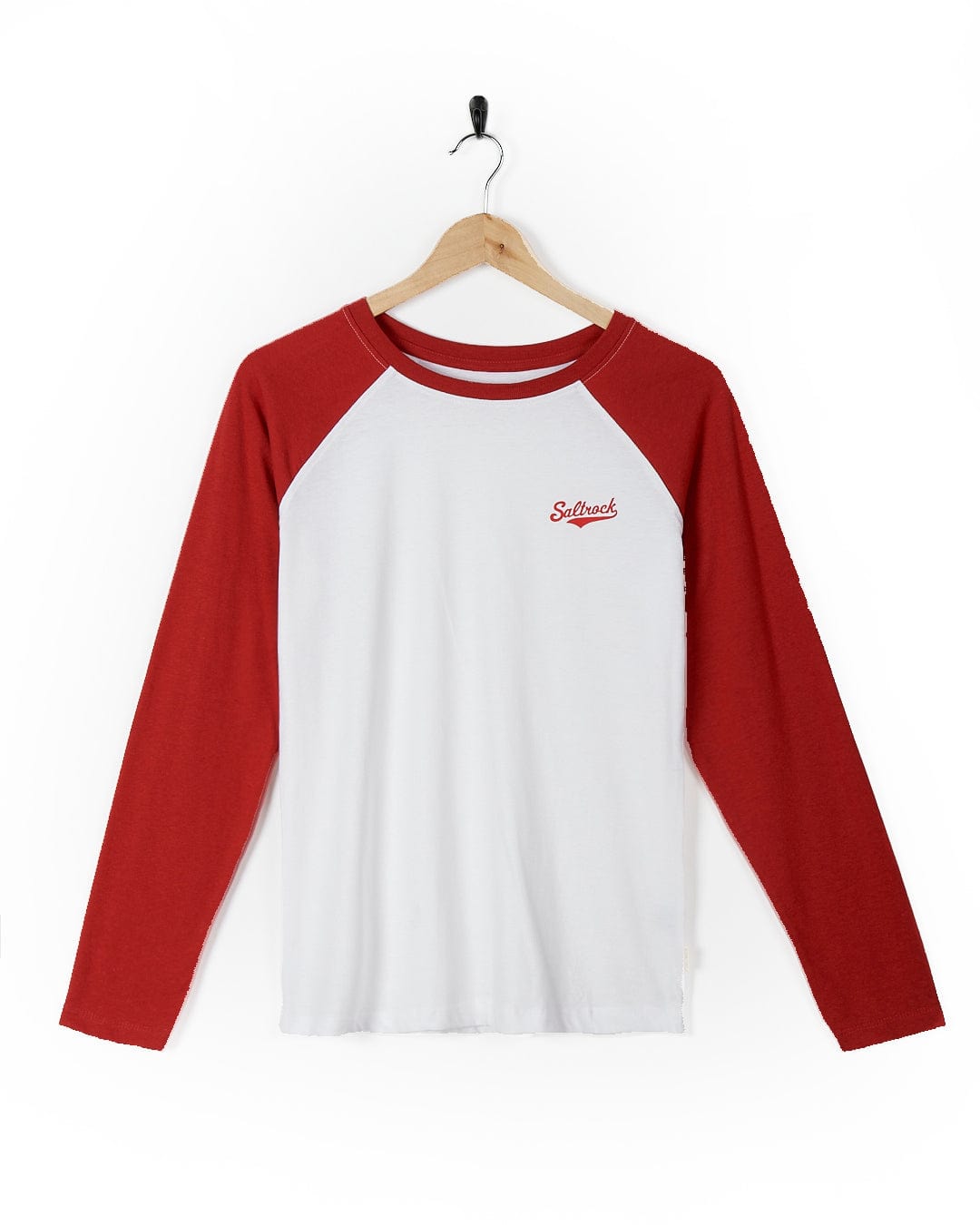 A Saltrock Carolina - Womens Long Sleeve Raglan T-Shirt - Red/White hanging on a hanger.