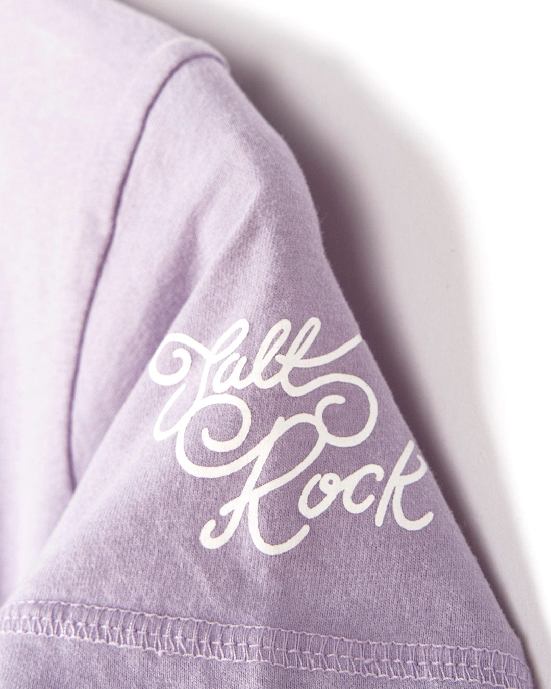 A Saltrock purple Chicory - Kids Snowwash Dress with the word 'fall rock' embroidered on it.