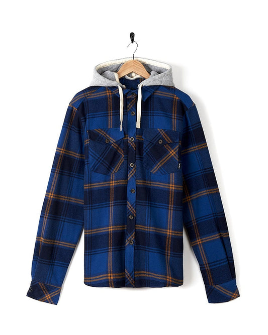 A Saltrock Colter - Mens Hooded Longsleeve Shirt - Dark Blue with a hoodie hanging on a hanger.