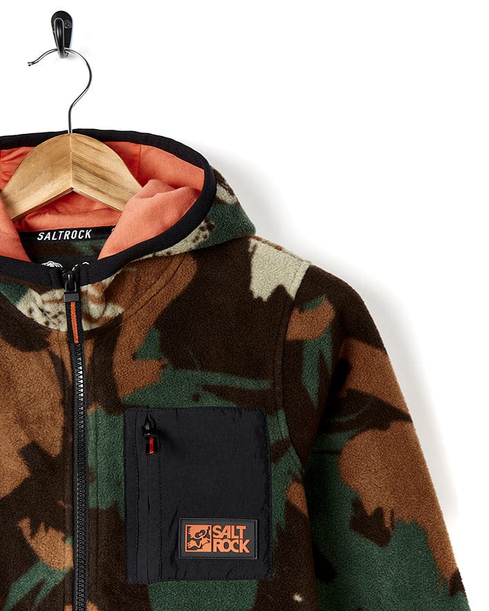 A Saltrock Communicado - Kids Camo Zip Fleece - Dark Green hoodie with an orange and black patch.