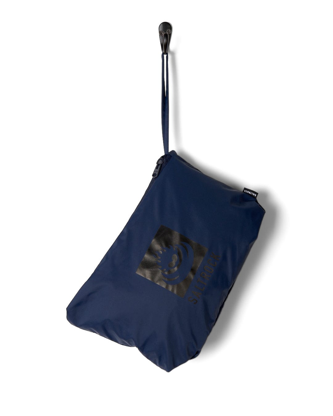A navy blue foldable tote bag with a glossy black logo, suspended by its black strap against a white background, crafted from 190T nylon.