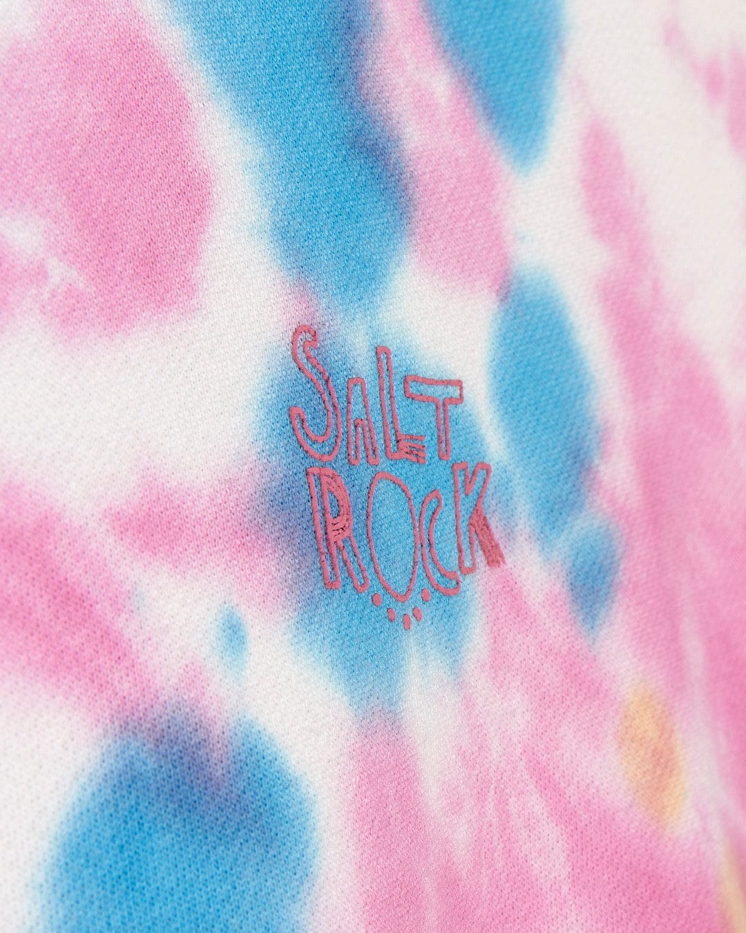 A close up of a Saltrock - Coralia Kids Tie Dye Crew Sweat - Pink shirt.