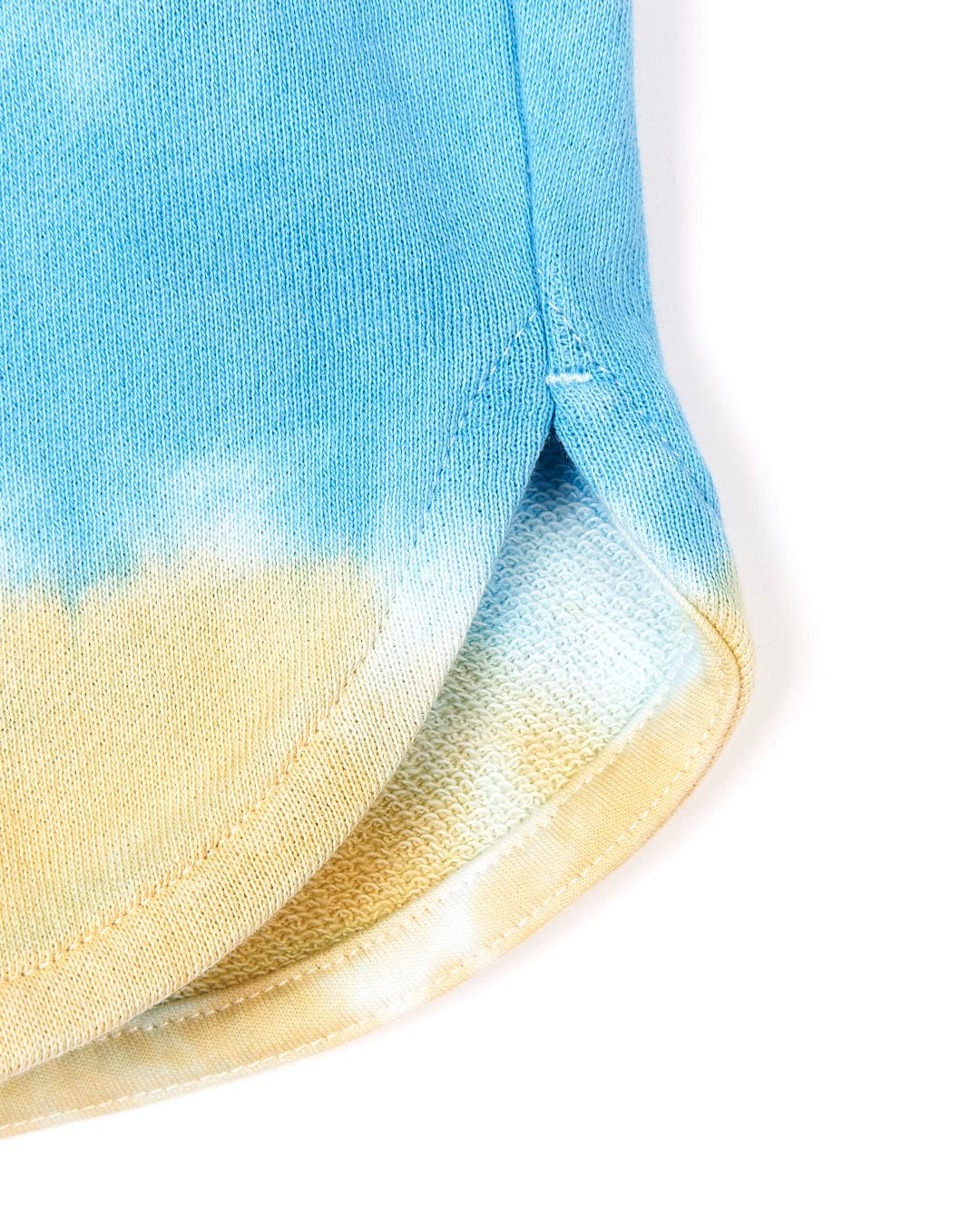 A close up of a Saltrock Coralia - Kids Tie Dye Sweat Short - Pink.