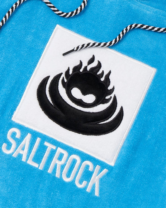Close-up of a Saltrock Corp Changing Towel - Blue branding logo on an ultra-absorbent, 100% cotton towel with a drawstring.