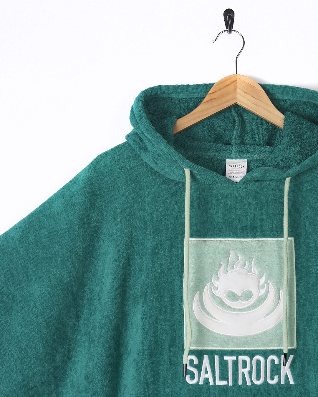 A green hoodie with the word Saltrock on it.
