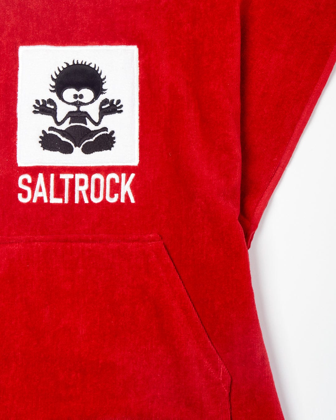 Close-up of a red Corp - Kids Changing Robe - Red towel with a white Saltrock logo featuring a stylized humanoid figure.