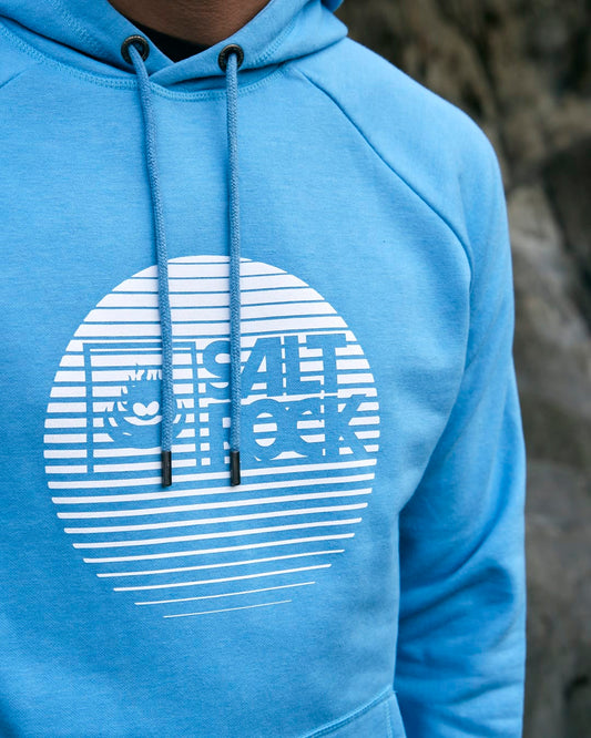 A man wearing a Saltrock Corp Logo Fade - Mens Hoodie - Light Blue with a light blue fabric.