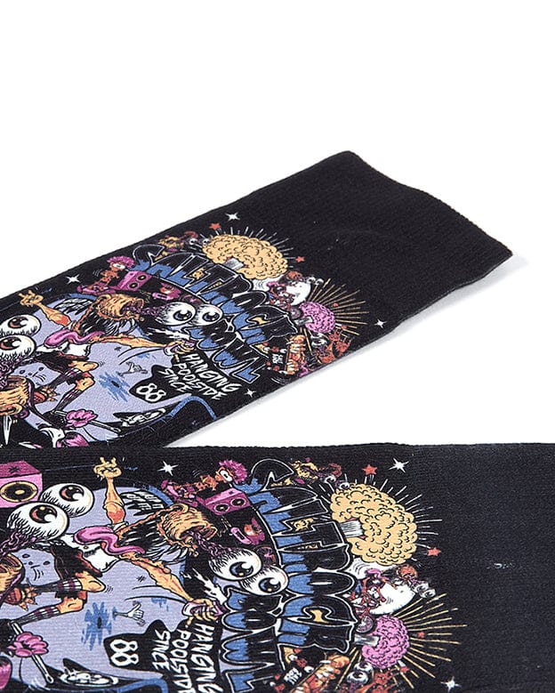 A pair of Creeper Encore - Kids Socks - Black with a skull design on them by Saltrock.