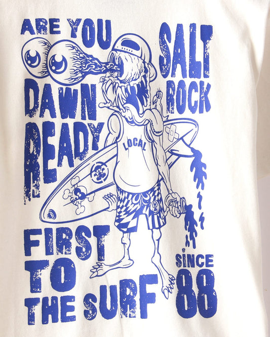 The Dawn Ready Kids T-Shirt by Saltrock features a surfer with two-eyed sunglasses and a flaming mouth, bold blue text, classic Saltrock branding since 1988. Made from 100% cotton and machine washable for easy care.