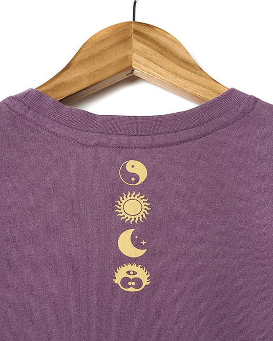 The back of a Saltrock Dawnrise - Kids Short Sleeve T-Shirt - Purple with the sun, moon and yin symbol.