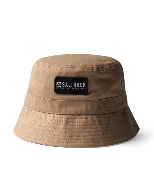 A beige nylon Dockyard bucket hat with a Saltrock badge on a white background.