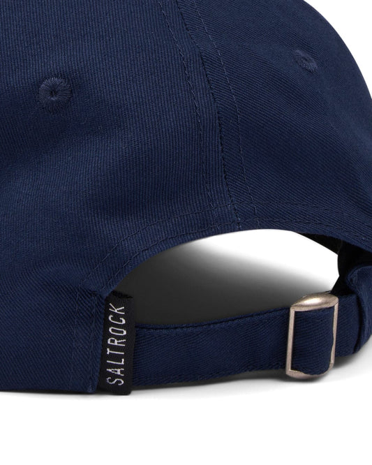 Close-up of a Dockyard - Cap - Dark Blue's adjustable back with a metal buckle and embroidered Saltrock badge.