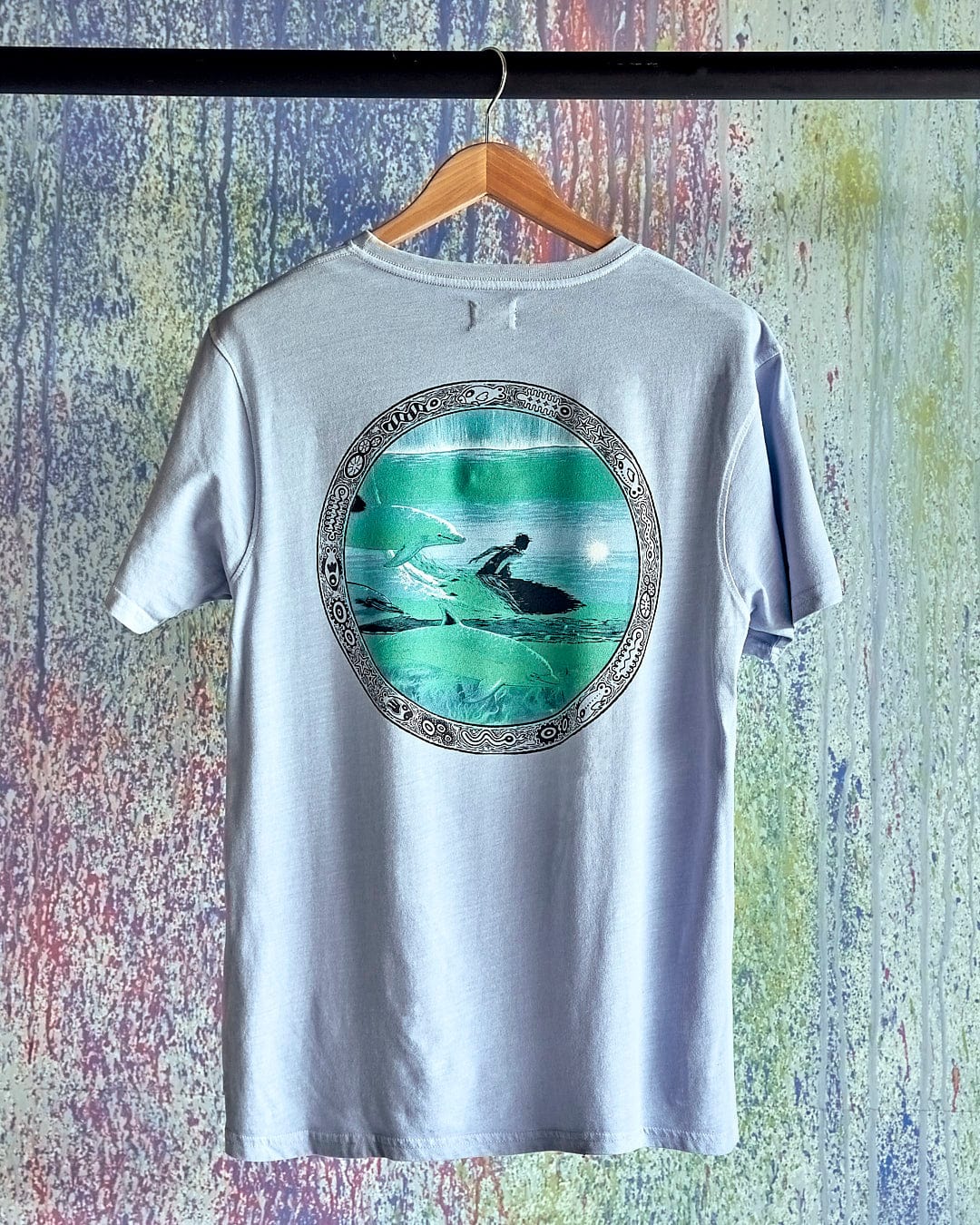 A Dolphin - Limited Edition 35 Years T-Shirt with an image of a surfer on it. (Saltrock)