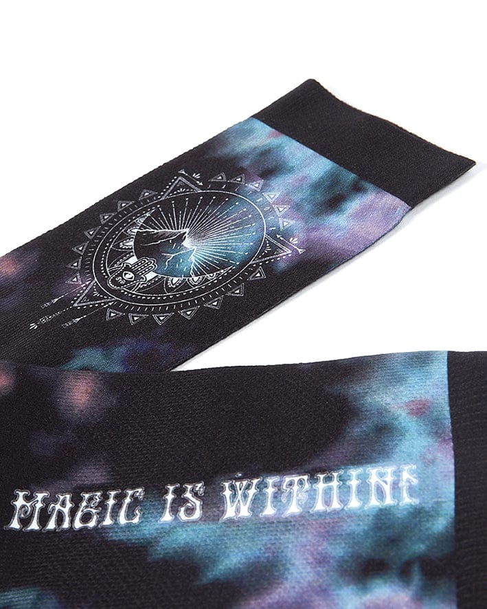 A pair of Dreamscape - Womens Socks - Black by Saltrock that say magic is within.