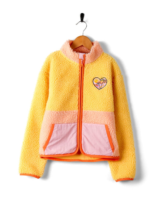 A Saltrock yellow and pink jacket with an embroidered heart.