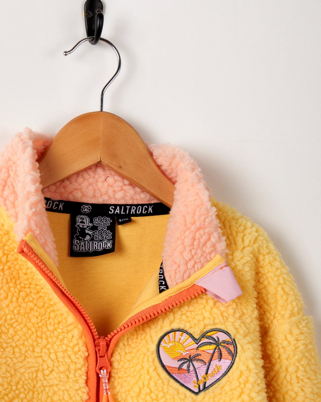 A Saltrock Emery Sunshine Kids Sherpa Fleece in Yellow with an embroidered heart.