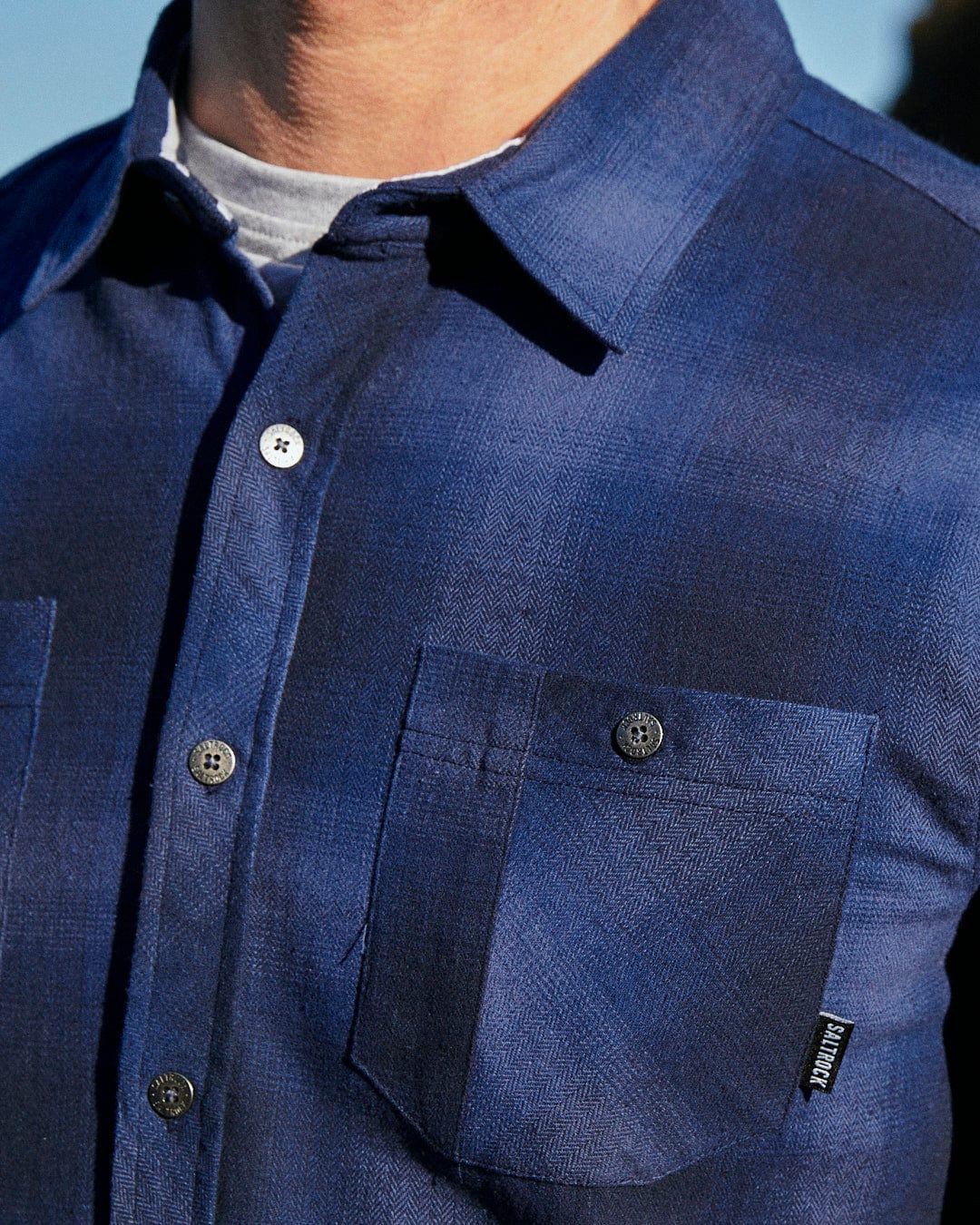 Description: A man wearing a Saltrock Farris - Mens Check Shirt - Blue made from 100% cotton.
