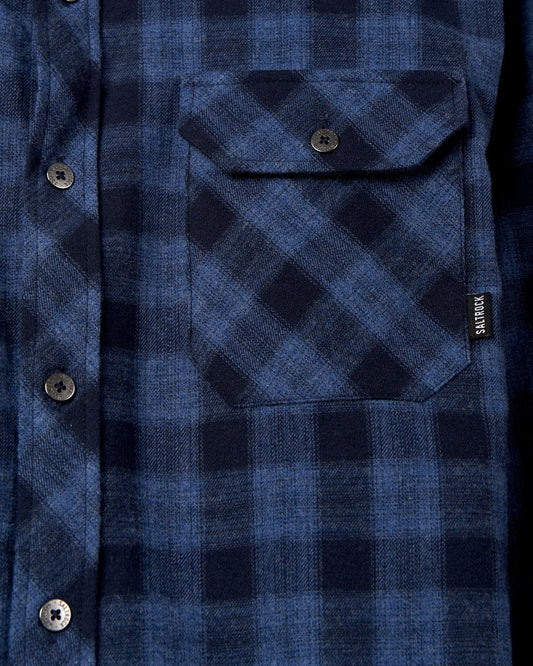 Close-up of a Saltrock Farrow - Mens Long Sleeve Blue Plaid Shirt with a buttoned pocket.