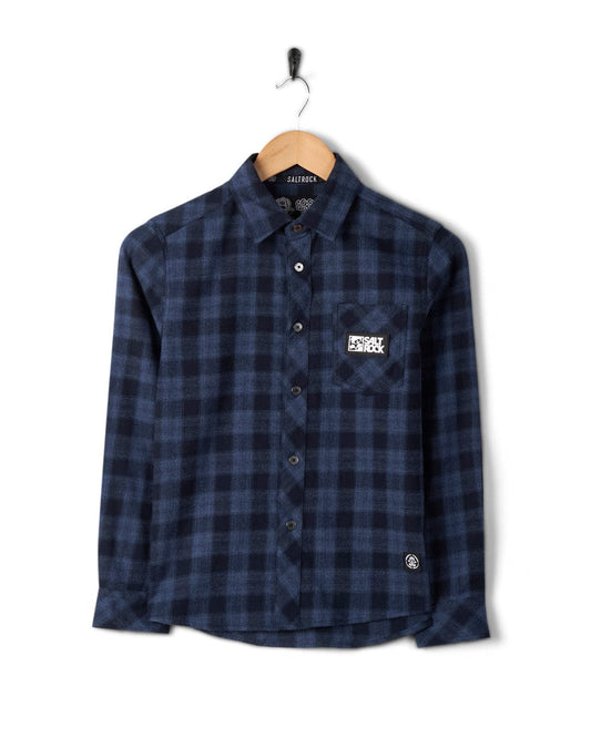A Farrow Kids Long Sleeve Shirt in Blue Check displayed on a wooden hanger against a plain white background.