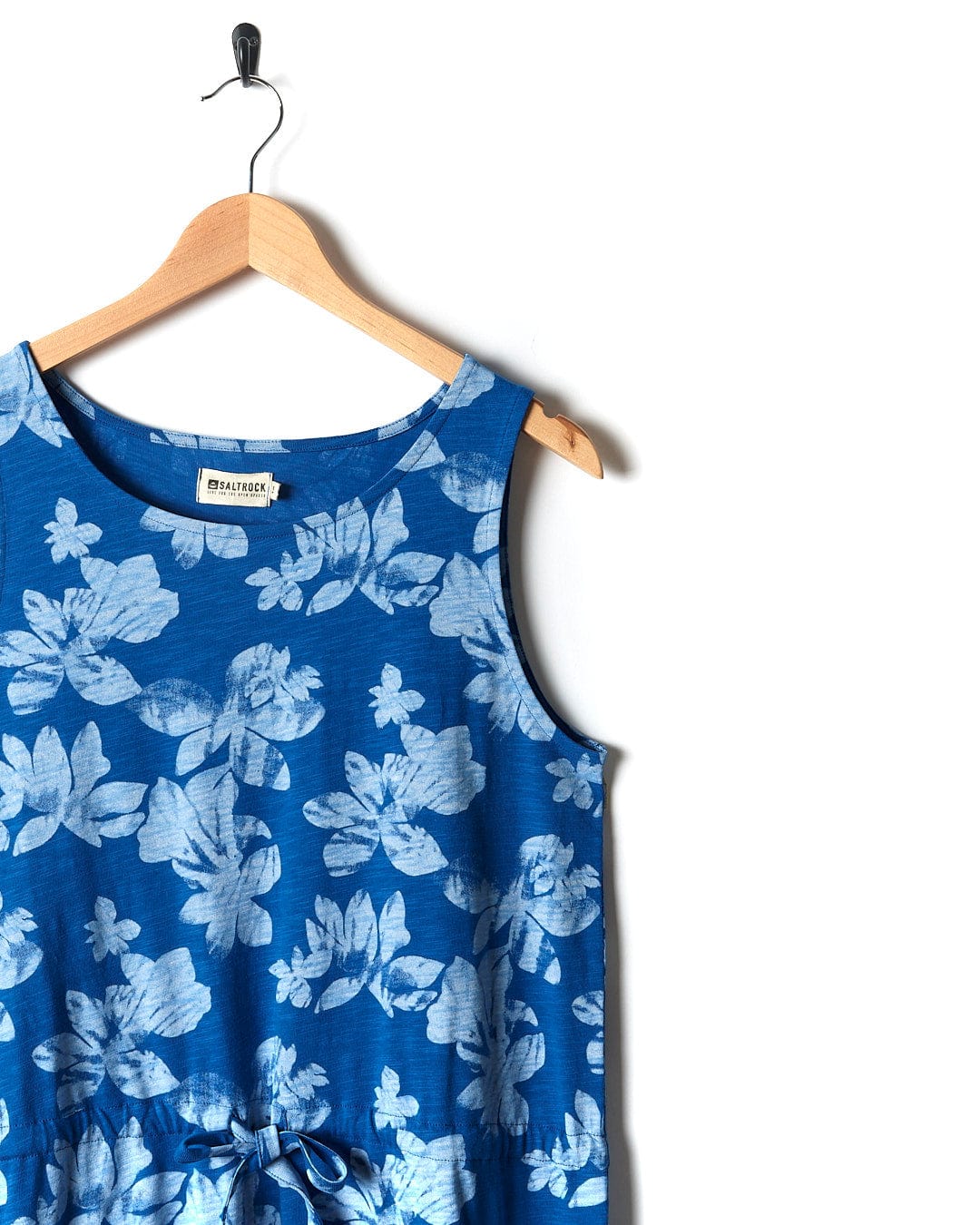 A Saltrock blue and white Floral - Womens Tie Vest Dress hanging on a hanger.