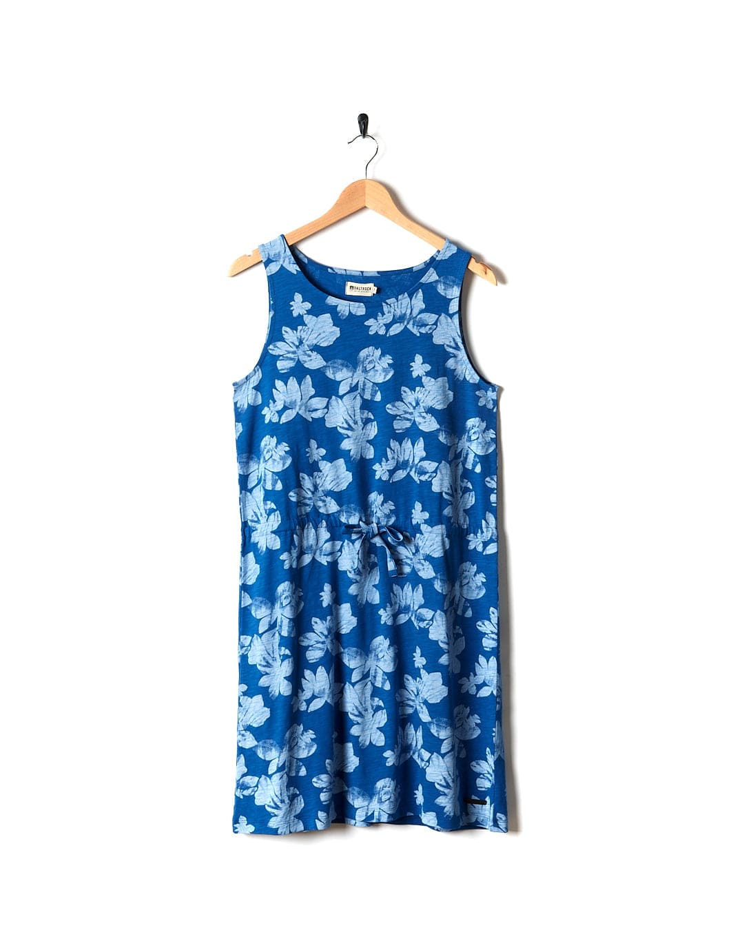 A Saltrock Floral - Womens Tie Vest Dress - Blue hanging on a hanger.