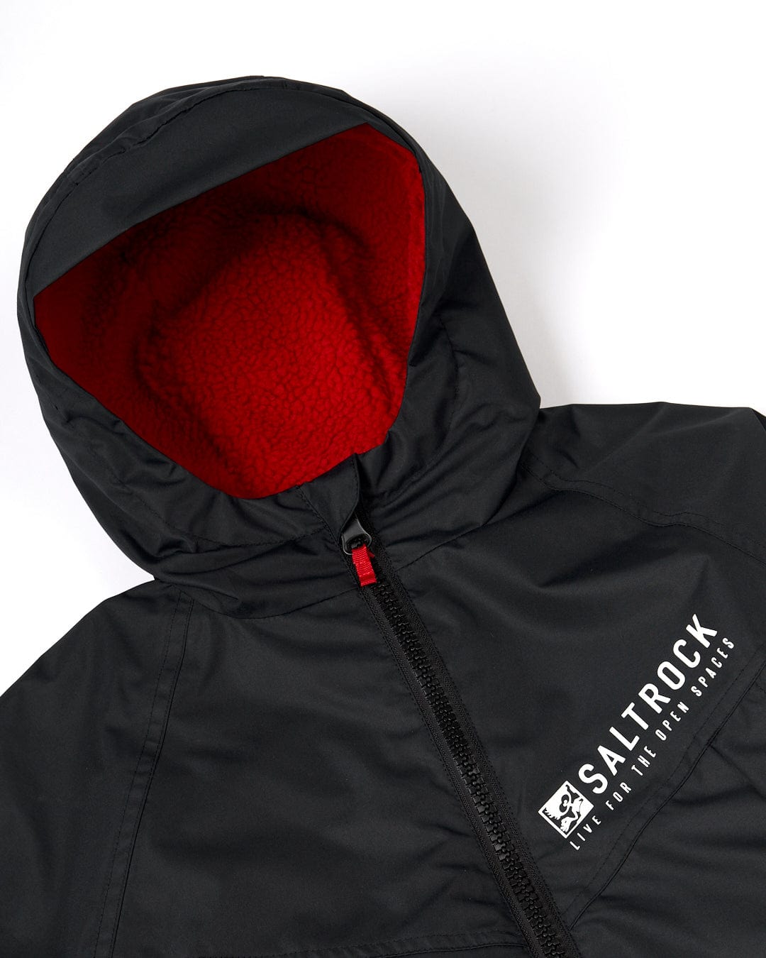 A Recycled Kids Changing Robe - Black/Red, featuring a hood and front zipper, crafted from recycled materials. The Saltrock logo and slogan "Live for the Open Spaces" are printed on the chest.