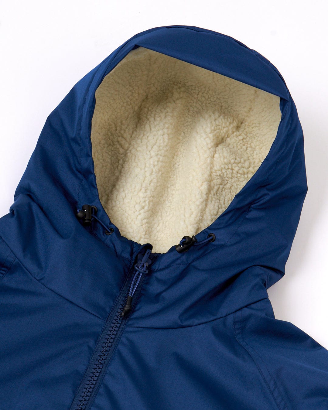 Close-up of a blue Changing Robe with a white fleece lining and drawstrings, featuring the Saltrock logo, showing the zipper partially unzipped.