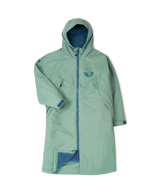 Saltrock's Recycled Changing Robe - Light Green, made from recycled materials, featuring a blue interior lining, a front zipper, and an emblem on the left chest area. One sleeve is extended while the other is slightly tucked.