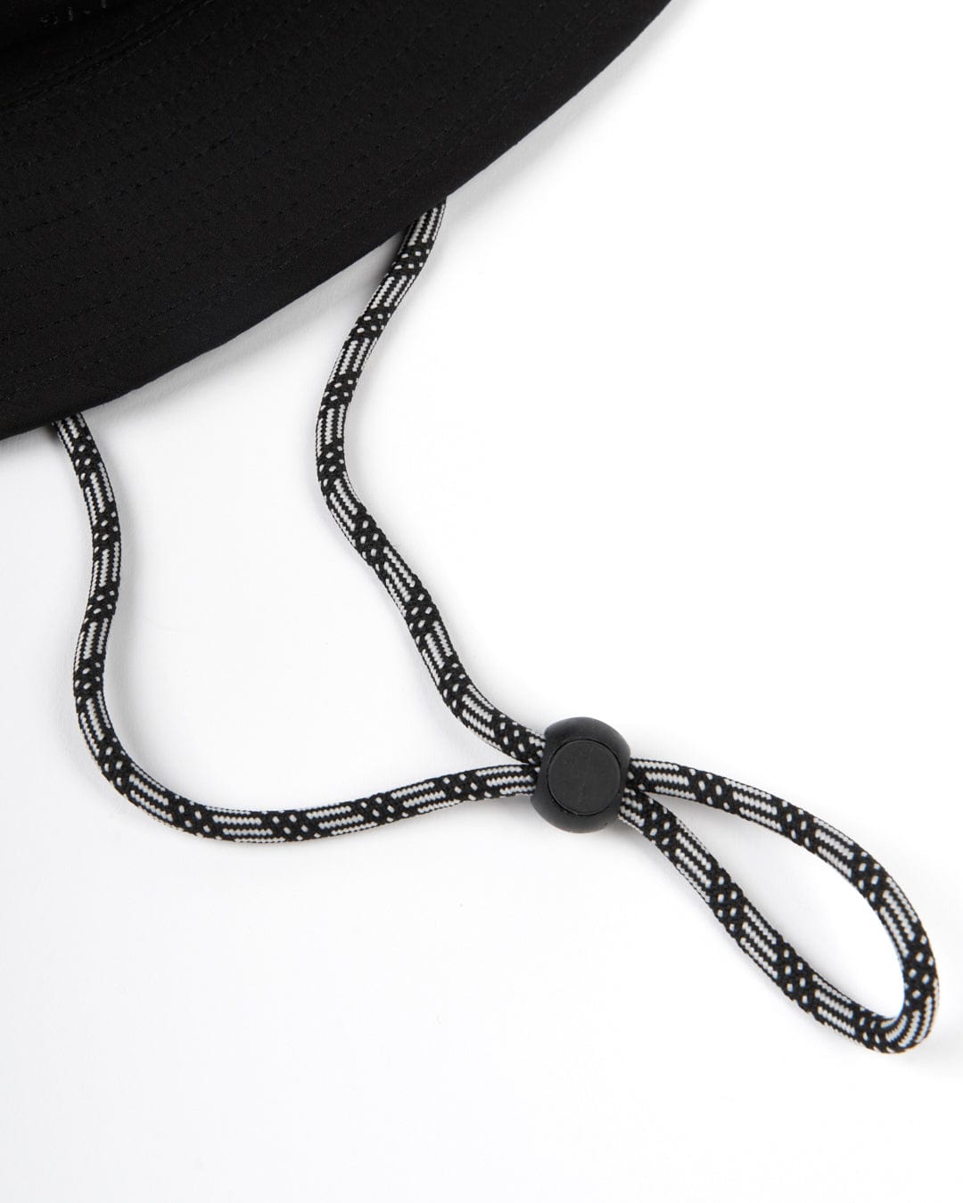 A Saltrock black bucket hat with UPF protection and a rope attached to it.
