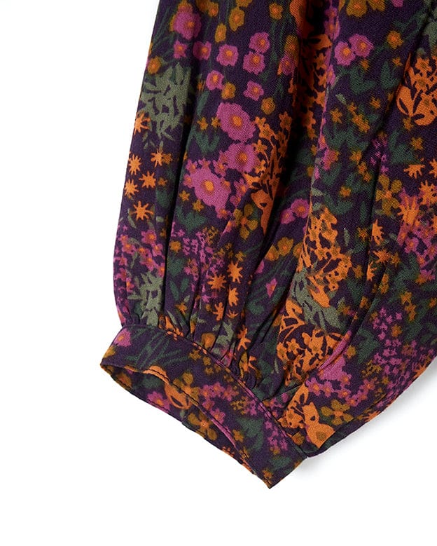 A close up of a Saltrock Garnet - All Over Print Blouse - Orange with a purple and orange floral print.