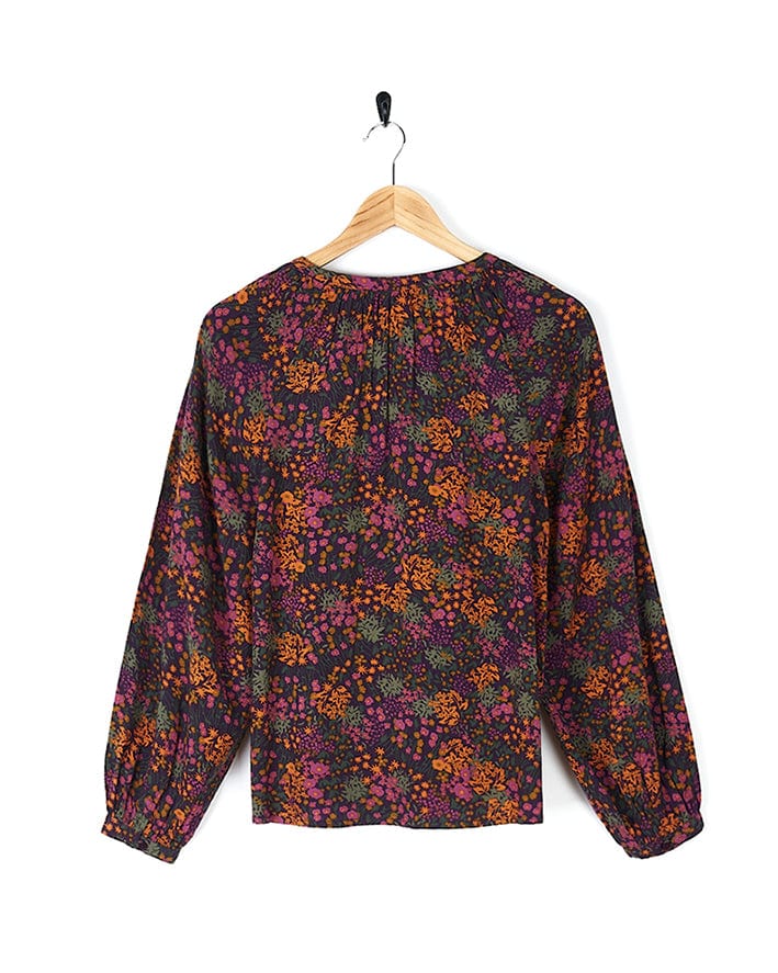 A Saltrock blouse with the Garnet - All Over Print Blouse - Orange and purple floral print.