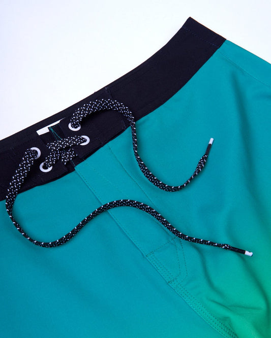 A Geo Palms - Mens Boardshorts - Green with a black belt, featuring 4 way stretch for ultimate comfort by Saltrock.