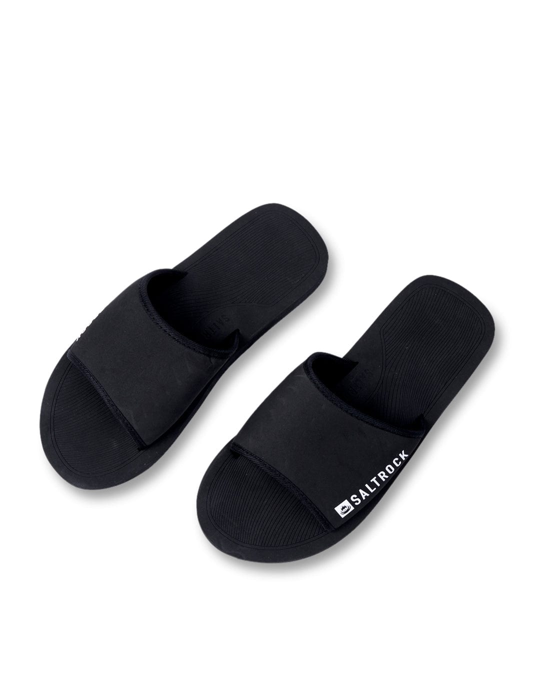 A pair of Ghost - Unisex Sliders - Black with Saltrock branding on the strap, positioned on a white background.