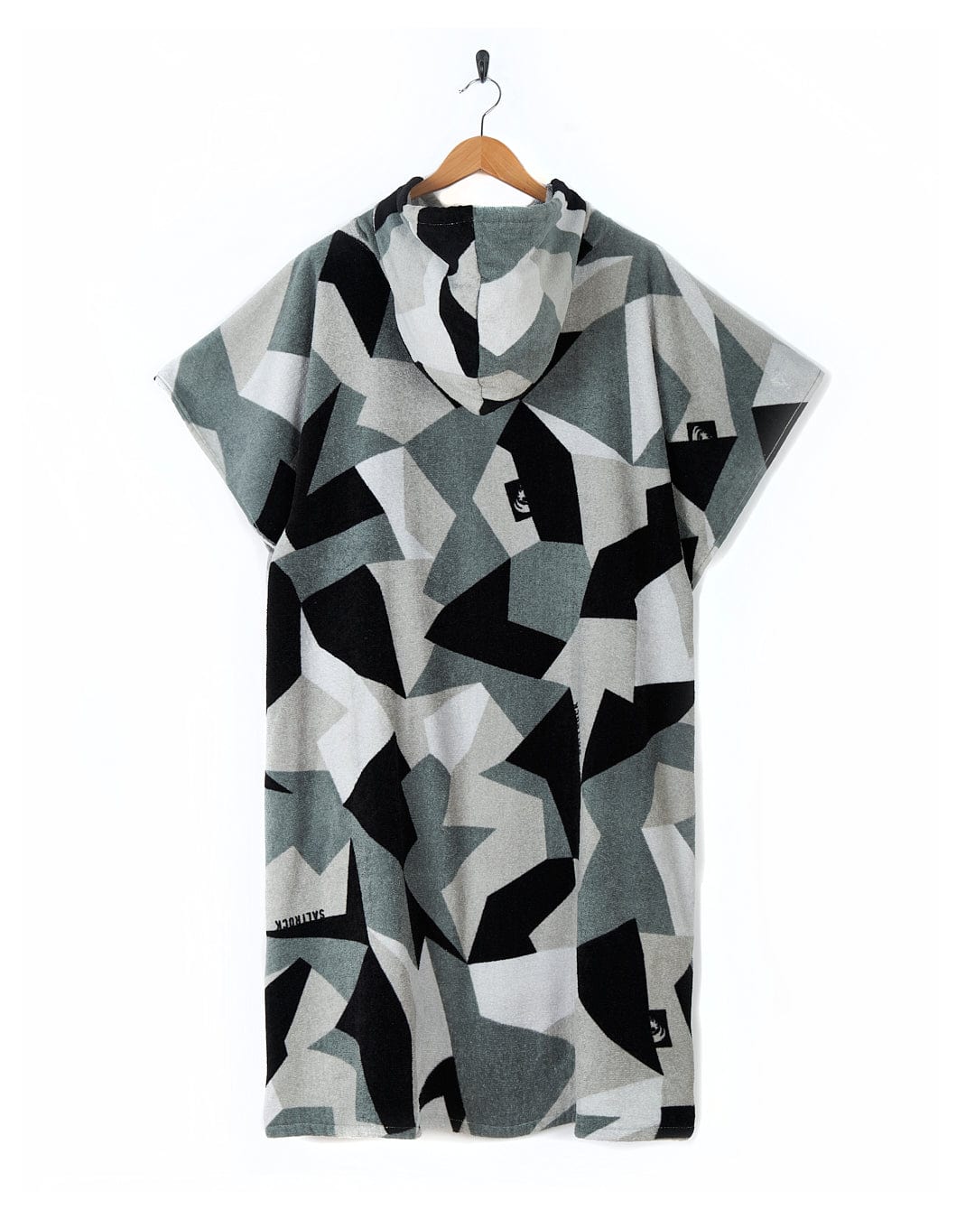 A 100% Cotton Geo Camo t-shirt hanging on a hanger against a white background.