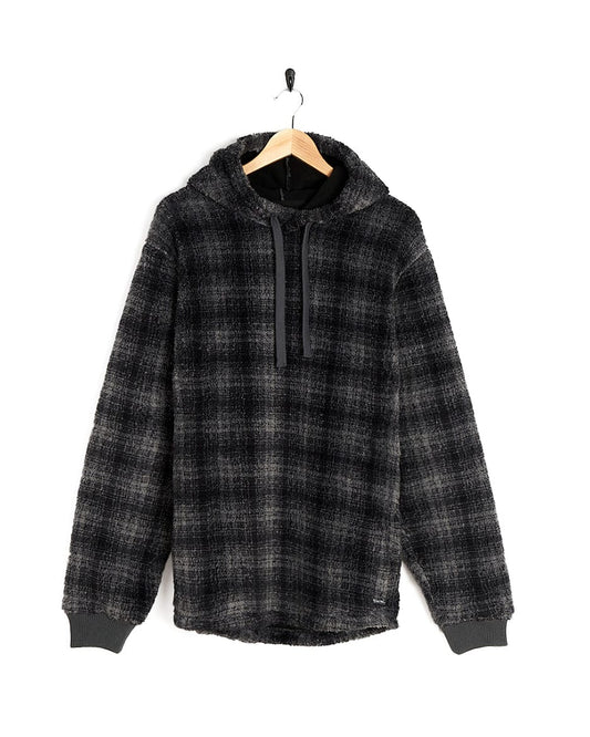 A black and grey Halycon - Mens Fleece Hoodie - Dark Grey with Saltrock branding, made of fleece material, hanging on a hanger.