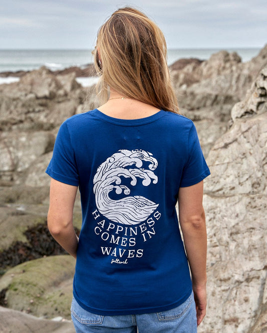 A woman wearing a Saltrock Happiness Velator - Womens T-Shirt - Navy, looking at the ocean.