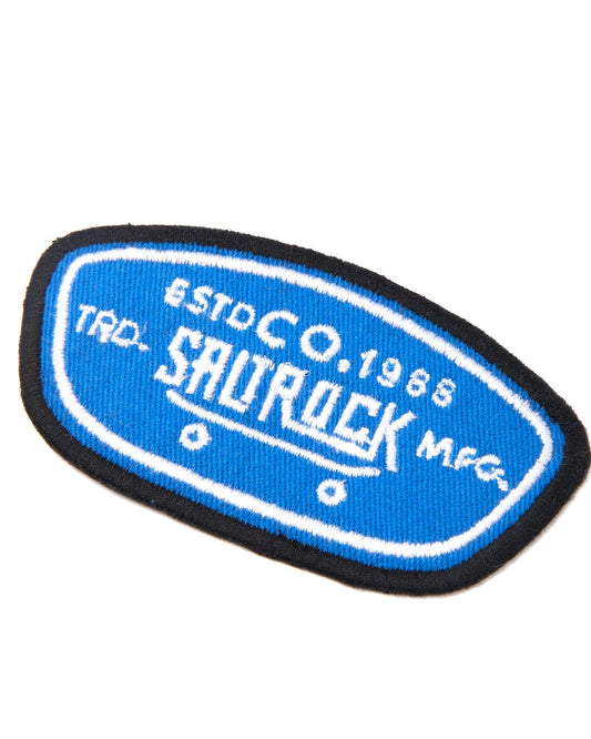 An embroidered Hardskate - Patches - Blue patch with the word Saltrock on it.