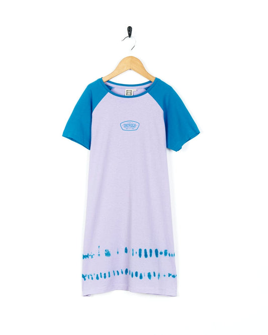 A blue and purple Hardskate - Kids Tie Dye T-Shirt Dress by Saltrock hanging on a hanger.