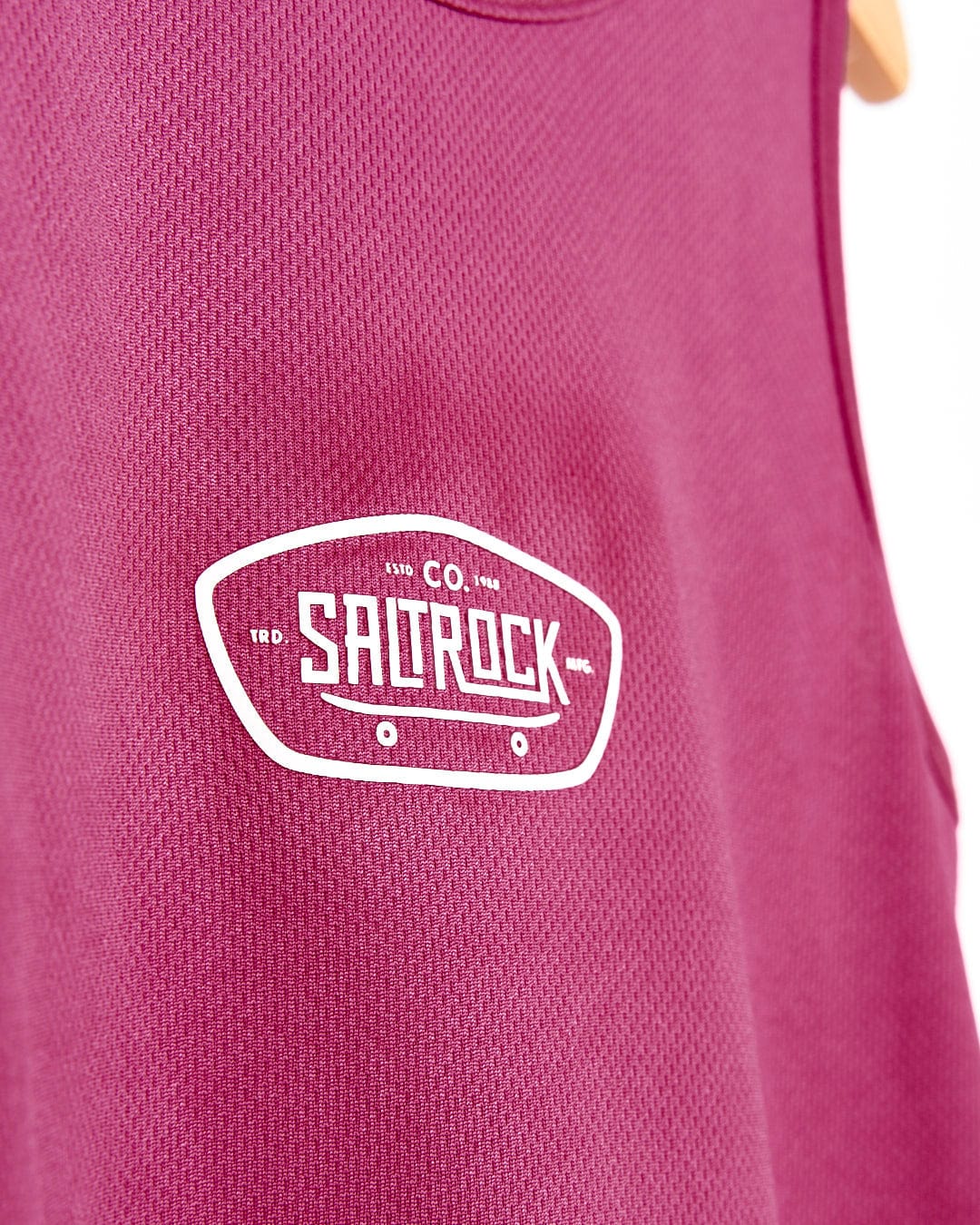 A Hardskate - Kids Vest - Dark Pink with the word Saltrock on it.