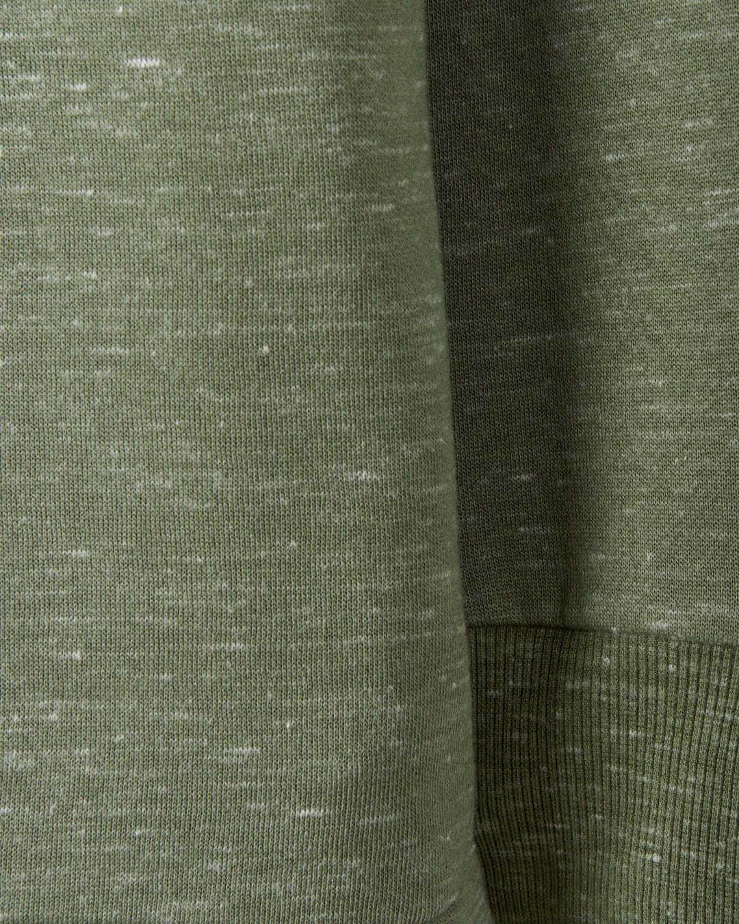 A close up of a Saltrock Harper - Womens Longline Pop Sweat - Green sweatshirt with embroidered branding.