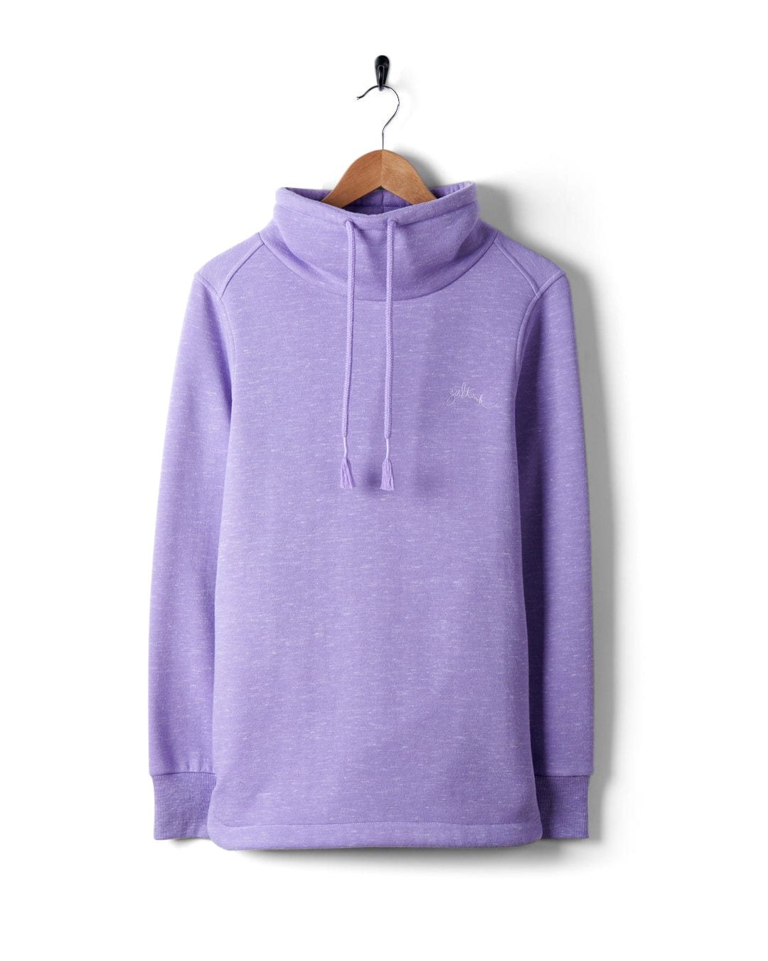 A Harper - Womens Longline Pop Sweat - Lilac sweatshirt from Saltrock, with embroidered branding, hanging on a hanger.