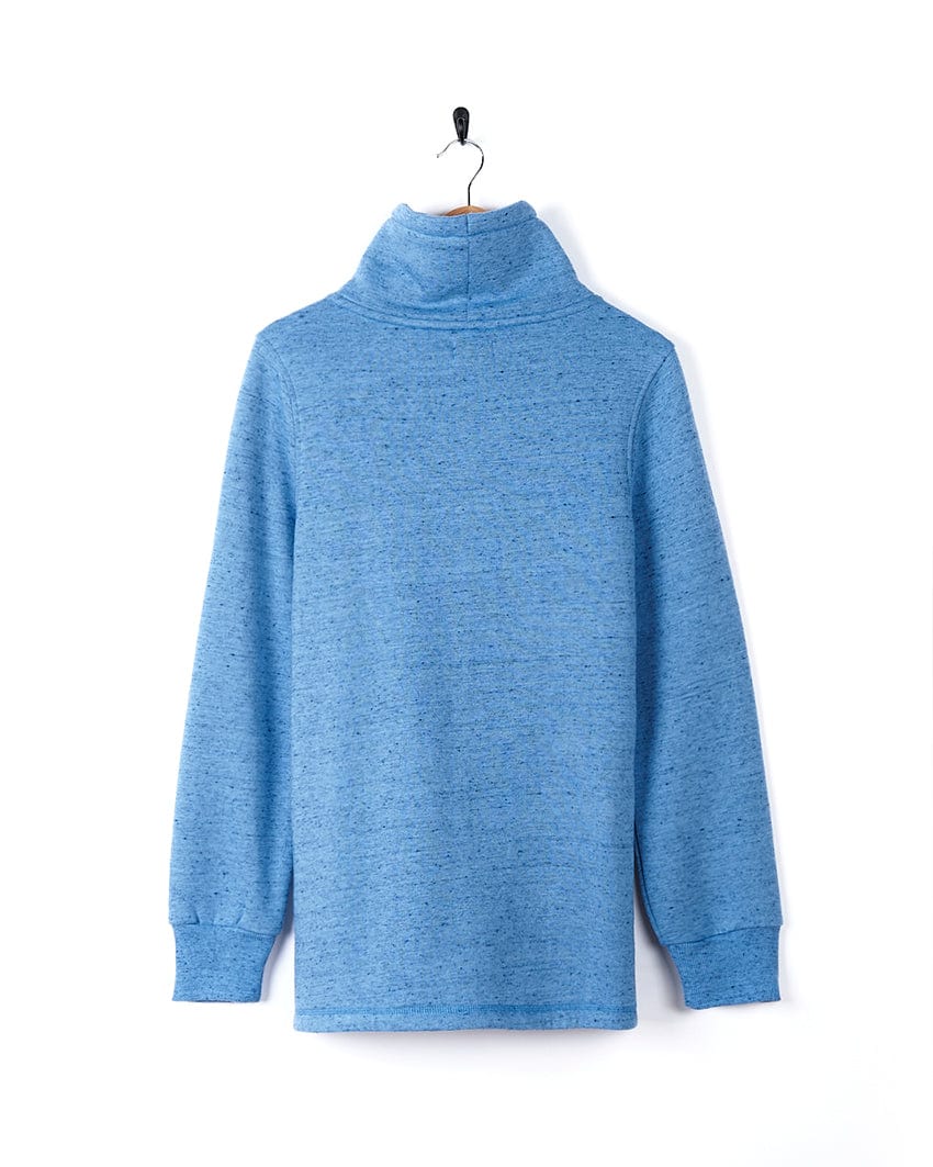 A comfortable Harper - Womens Longline Pop Sweat - Light Blue turtle neck sweater hanging on a hanger, made by Saltrock.